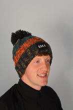 Load image into Gallery viewer, Orange Twist Bobble Hat
